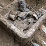 Corroded septic system d-box